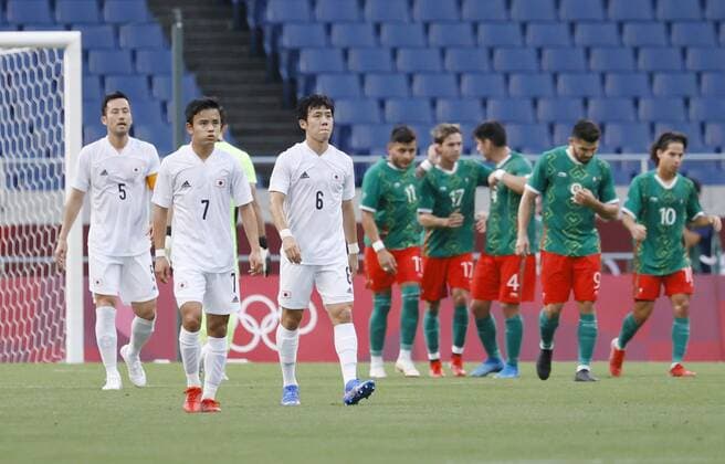 Tokyo Olympics: Football Mexico players (green) celebrate after opening the scoring against Japan during the first half of the men s football bronze medal match at the Tokyo Olympics on Aug. 6, 2021, at Saitama Stadium near Tokyo.  A14AA0000756879P