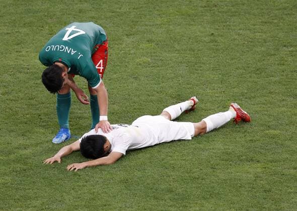 Tokyo Olympics: Football Mexico s Jesus Angulo (4) comforts Takefusa Kubo of Japan after Mexico s 3-1 win in the men s football bronze medal match at the Tokyo Olympics on Aug. 6, 2021, at Saitama Stadium near Tokyo.  A14AA0000756880P