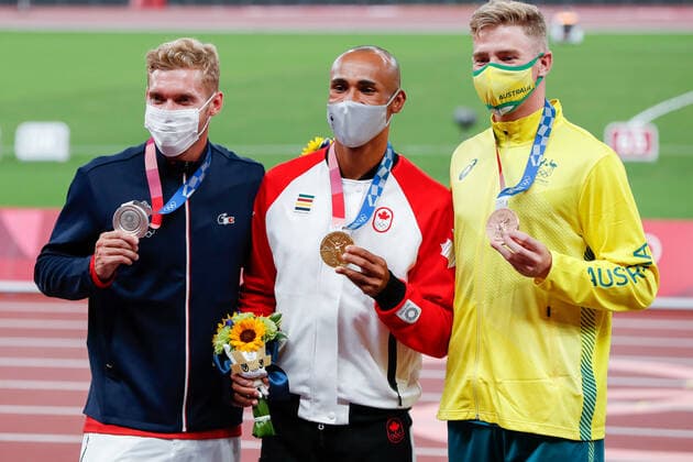 Men s decathlon medalists from left silver medalist .Kevin Mayer of France, gold medalist Damian Warner of Canada and bronze Ashley Moloney of Australia pose for a photo during the medal ceremony at Olympic Stadium at the 2020 Summer Olympics in Tokyo, Japan on Friday, August 6, 2021. Damian Warner of Canada took gold with 9018 points, Kevin Mayer of France took silver with 8726 points and Ashley Moloney of Australia took bronze with 8649 points.  OLY20210806415 TasosxKatopodis
