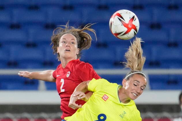 August 6, 2021, Tokyo, Japan: Canada s Allysha Chapman and Sweden s Kosovare Asllani jump for the ball in the women s soccer final during the summer Tokyo Olympics in Tokyo, Japan on Friday, August 6, 2021. Canada News - August 6, 2021  - ZUMAc35_ 20210806_zaf_c35_014 Copyright: xFrankxGunnx