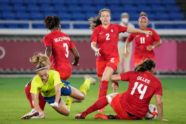 August 6, 2021, Tokyo, Japan: Sweden s Kosovare Asllani trips over Canada s Vanessa Gilles in the women s soccer final during the summer Tokyo Olympics in Tokyo, Japan on Friday, August 6, 2021. Canada News - August 6, 2021  - ZUMAc35_ 20210806_zaf_c35_013 Copyright: xFrankxGunnx
