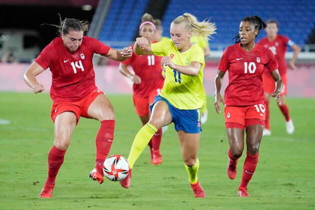 August 6, 2021, Tokyo, Japan: Sweden s Stina Blackstenius (11) handles the ball in front of Canada s Vanessa Gilles (14) and Ashley Lawrence (10) in the women s soccer final during the summer Tokyo Olympics in Tokyo, Japan on Friday, August 6, 2021. Canada News - August 6, 2021  - ZUMAc35_ 20210806_zaf_c35_019 Copyright: xFrankxGunnx