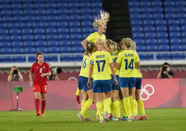 August 6, 2021, Yokohama, Japan: Sweden players celebrate a first half goal by Stina Blackstenius as Canada s Allysha Chapman (left) looks on during the women s soccer gold medal game at the Tokyo Olympics in Yokohama, Japan on Friday, August 6, 2021. Canada News - August 6, 2021  - ZUMAc35_ 20210806_zaf_c35_032 Copyright: xAdrianxWyldx
