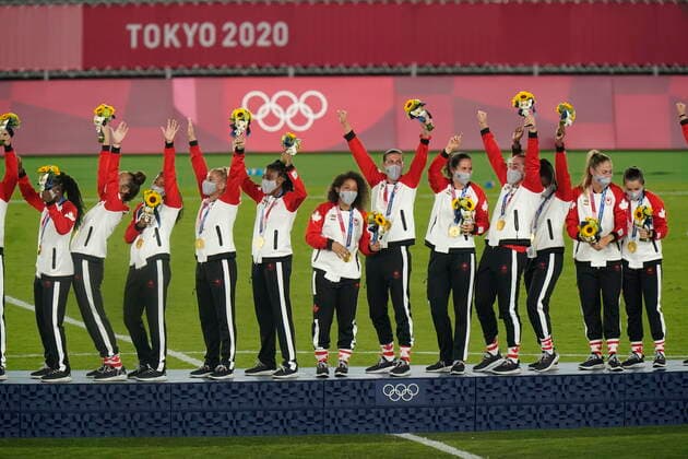 August 7, 2021, Yokohama, Japan: Canadian soccer players celebrate on the podium during the medal ceremony after their win against Sweden in the women s soccer gold medal game at the Tokyo Olympics in Yokohama, Japan on Friday, August 6, 2021. Canada News - August 7, 2021  - ZUMAc35_ 20210807_zaf_c35_005 Copyright: xAdrianxWyldx