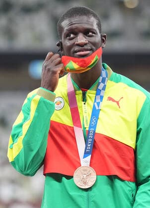 (210806) -- TOKYO, Aug. 6, 2021 -- Kirani James of Grenada reacts during the awarding ceremony of the Men s 400m at the Tokyo 2020 Olympic Games, Olympische Spiele, Olympia, OS in Tokyo, Japan, Aug. 6, 2021. ) (TOKYO2020)JAPAN-TOKYO-OLY-ATHLETICS-MEN S 400M-AWARDING CEREMONY LuixSiuxWai 