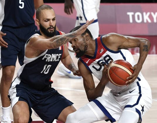 United States Kevin Durant is defended by France s Evan Fournier in Men s Basketball final at the Tokyo 2020 Olympics, Saturday, August 7, 2021, in Tokyo, Japan. USA defeated France, winning the Gold Medal, 87-82.  OLY20210807807 MIKExTHEILER
