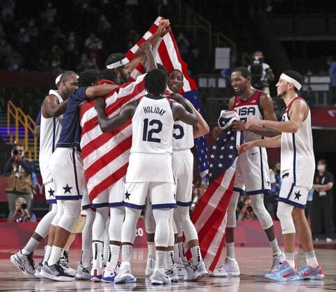 Tokyo Olympics: Basketball The U.S. men s basketball team celebrates after winning the Tokyo Olympic gold medal game against France on Aug. 7, 2021, at Saitama Super Arena near Tokyo.  A14AA0000756968P