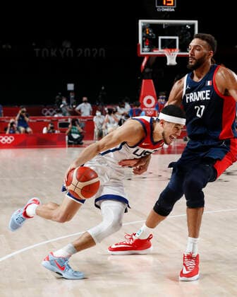 August 7, 2021, Tokyo, Kanto, Japan: Devin Booker (15) of Team United States drives against Rudy Gobert (27) of Team France in the men s basketball gold medal game during the Tokyo 2020 Olympic Summer Games at Saitama Super Arena. Tokyo Japan - ZUMAm117 20210807_zaf_m117_039 Copyright: xDavidxG.xMcintyrex