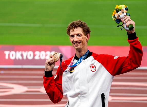 August 7, 2021, Tokyo, Japan: Evan Dunfee of Canada shows off his bronze medal for the menÃ¢â‚¬â ¢s 50km race walk at the Tokyo Olympics in Tokyo, Japan on Saturday August 7, 2021. Canada News - August 7, 2021  - ZUMAc35_ 20210807_zaf_c35_032 Copyright: xFrankxGunnx