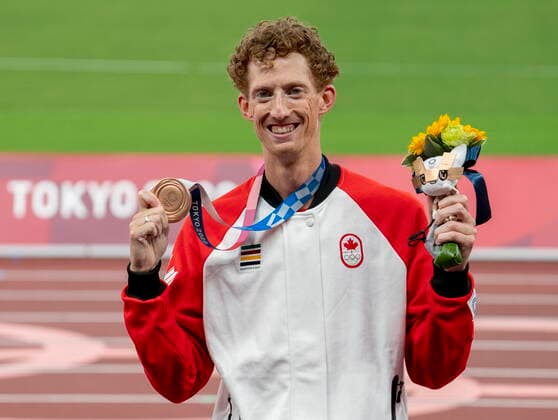 August 7, 2021, Tokyo, Japan: Evan Dunfee of Canada shows off his bronze medal for the menÃ¢â‚¬â ¢s 50km race walk at the Tokyo Olympics in Tokyo, Japan on Saturday August 7, 2021. Canada News - August 7, 2021  - ZUMAc35_ 20210807_zaf_c35_033 Copyright: xFrankxGunnx
