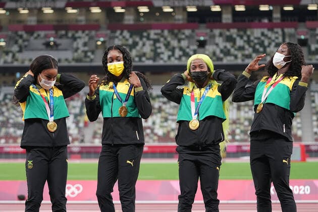 (210807) -- TOKYO, Aug. 7, 2021 -- Team members of Jamaica react during the awarding ceremony of the Women s 4x100m Relay at the Tokyo 2020 Olympic Games, Olympische Spiele, Olympia, OS in Tokyo, Japan, Aug. 7, 2021. ) (TOKYO2020)JAPAN-TOKYO-OLY-ATHLETICS-WOMEN S 4x100M RELAY-AWARDING CEREMONY LuixSiuxWai 
