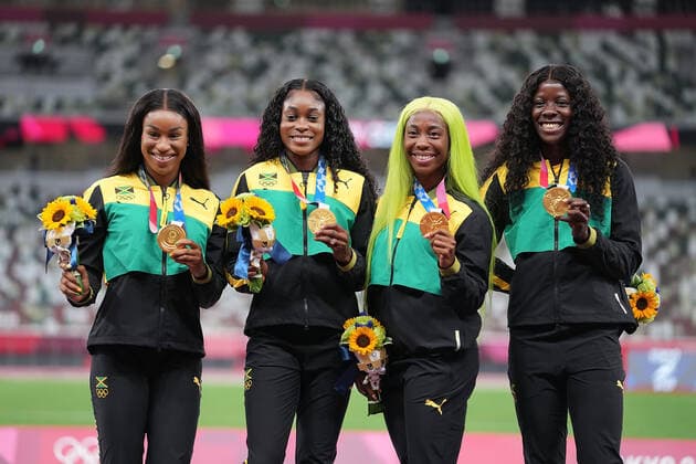 (210807) -- TOKYO, Aug. 7, 2021 -- Team members of Jamaica react during the awarding ceremony of the Women s 4x100m Relay at the Tokyo 2020 Olympic Games, Olympische Spiele, Olympia, OS in Tokyo, Japan, Aug. 7, 2021. ) (TOKYO2020)JAPAN-TOKYO-OLY-ATHLETICS-WOMEN S 4x100M RELAY-AWARDING CEREMONY LuixSiuxWai 
