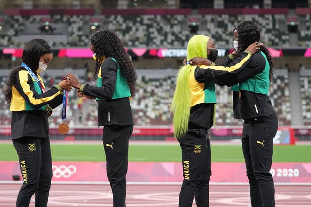 (210807) -- TOKYO, Aug. 7, 2021 -- Team members of Jamaica react during the awarding ceremony of the Women s 4x100m Relay at the Tokyo 2020 Olympic Games, Olympische Spiele, Olympia, OS in Tokyo, Japan, Aug. 7, 2021. ) (TOKYO2020)JAPAN-TOKYO-OLY-ATHLETICS-WOMEN S 4x100M RELAY-AWARDING CEREMONY LuixSiuxWai 
