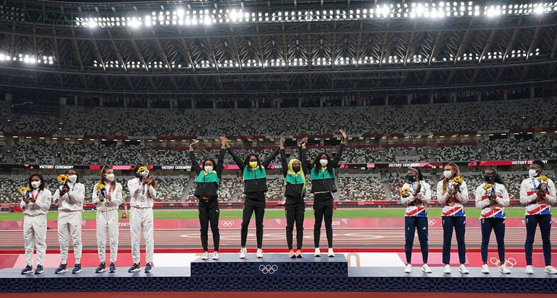 (210807) -- TOKYO, Aug. 7, 2021 -- Team members of Jamaica (C), the United States (L) and the Great Britain react during the awarding ceremony of the Women s 4x100m Relay at the Tokyo 2020 Olympic Games, Olympische Spiele, Olympia, OS in Tokyo, Japan, Aug. 7, 2021. ) (TOKYO2020)JAPAN-TOKYO-OLY-ATHLETICS-WOMEN S 4x100M RELAY-AWARDING CEREMONY LuixSiuxWai 