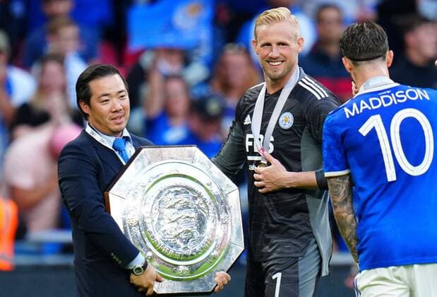 Mandatory Credit: Photo by Javier Garcia Shutterstock (12250603al) Aiyawatt Top Srivaddhanaprabha celebrates with the Community Shield alongside Leicester City goalkeeper Kasper Schmeichel Leicester City v Manchester City, The FA Community Shield, Football, Wembley Stadium, London, UK - 7 August 2021 EDITORIAL USE ONLY No use with unauthorised audio, video, data, fixture lists, club league logos or live services. Online in-match use limited to 120 images, no video emulation. No use in betting, games or single club league player publications. Leicester City v Manchester City, The FA Community Shield, Football, Wembley Stadium, London, UK - 7 August 2021 EDITORIAL USE ONLY No use with unauthorised audio, video, data, fixture lists, club league logos or live services. Online in-match use limited to 120 images, no video emulation. No use in betting, games or single club league player publications. Copyright: xJavierxGarcia Shutterstockx 12250603al