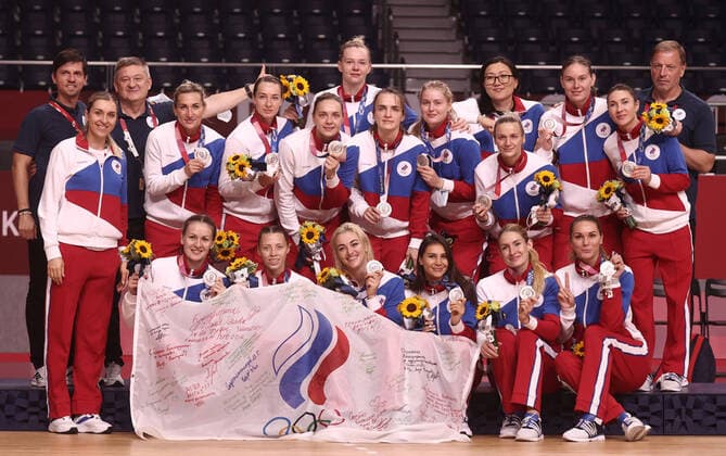TOKYO, JAPAN - AUGUST 8, 2021: Team ROC players (silver) pose for a group photograph during the victory ceremony for womenâ€™s handball at the Yoyogi National Gymnasium during the 2020 Summer Olympic Games, Olympische Spiele, Olympia, OS Valery Sharifulin TASS  TS10C040