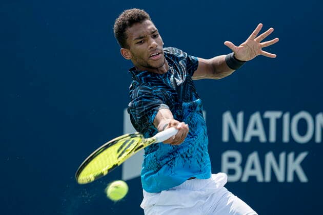 August 9, 2021, Toronto, on, Canada: Canada s Felix Auger-Aliassime returns the ball during Men s National Bank Open doubles tennis action against Russia s Karen Khachanov and Andrey Rublev, in Toronto on Monday, Aug., 9, 2021. Canada News - August 9, 2021  - ZUMAc35_ 20210809_zaf_c35_071 Copyright: xChristopherxKatsarovx