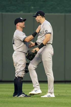 New York Yankees center fielder Joey Gallo (13) converses with left fielder Brett Gardner (11) after Gardner failed to catch the Kansas City Royals fly ball in the third inning at Kaufman Stadium in Kansas City, Missouri on Monday, August 09, 2021.  KCP20210809116 KYLExRIVAS