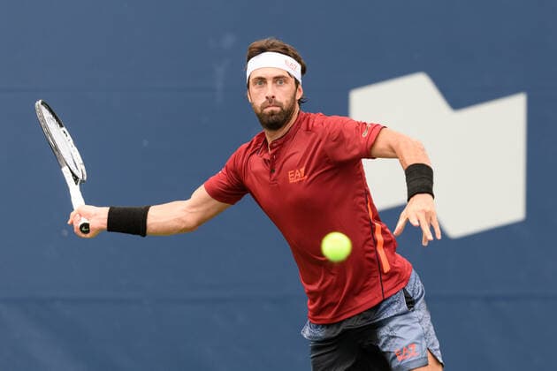 TORONTO, ON - AUGUST 10: Nikoloz Basilashvili (GEO) returns the ball during his National Bank Open tennis tournament first round game on August 10, 2021, at Aviva Centre in Toronto, ON, Canada. (Photo by Julian Avram Icon Sportswire) TENNIS: AUG 10 National Bank Open Icon2108100312
