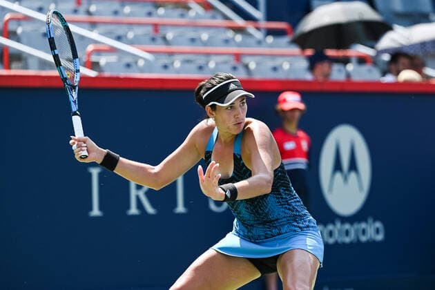 August 10, 2021: Grabine Muguruza (ESP) returns the ball during the WTA, Tennis Damen National Bank Open second round match at IGA Stadium in Montreal, Quebec. CSM Montreal Canada - ZUMAc04_ 20210810_zaf_c04_037 Copyright: xDavidxKirouacx
