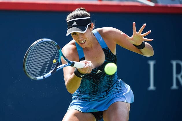 MONTREAL, QC - AUGUST 10: Grabine Muguruza (ESP) returns the ball during the second round WTA, Tennis Damen National Bank Open match on August 10, 2021 at IGA Stadium in Montreal, QC (Photo by David Kirouac Icon Sportswire) TENNIS: AUG 10 National Bank Open Icon210810048
