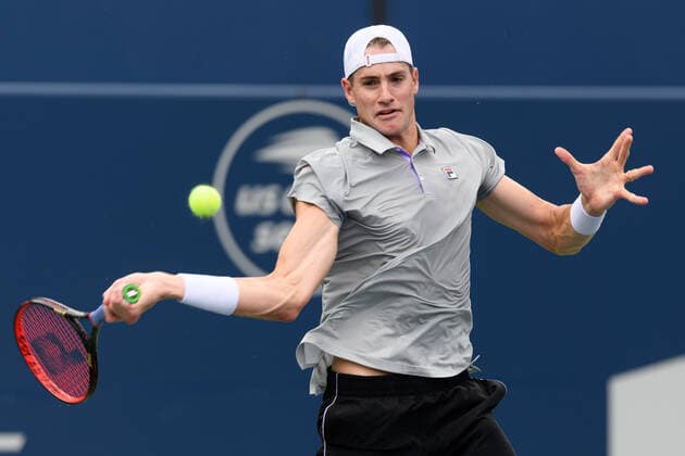 TORONTO, ON - AUGUST 10: John Isner (USA) returns the ball during his National Bank Open tennis tournament first round game on August 10, 2021, at Aviva Centre in Toronto, ON, Canada. (Photo by Julian Avram Icon Sportswire) TENNIS: AUG 10 National Bank Open Icon2108100684