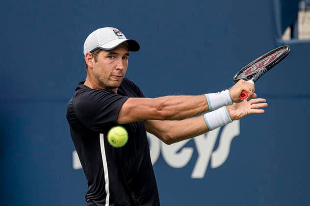August 11, 2021, Toronto, on, Canada: SerbiaÃ¢â‚¬â ¢s Dusan Lajovic returns the ball to CanadaÃ¢â‚¬â ¢s Felix Auger-Aliassime during MenÃ¢â‚¬â ¢s National Bank Open tennis action, in Toronto, Wednesday, Aug. 11, 2021. Canada News - August 11, 2021  - ZUMAc35_ 20210811_zaf_c35_039 Copyright: xChristopherxKatsarovx