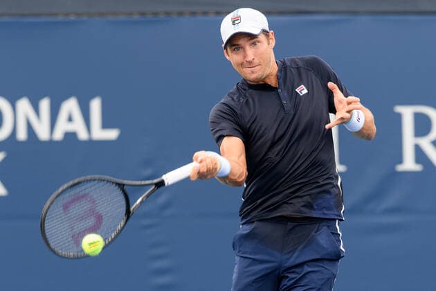 TORONTO, ON - AUGUST 12: Dusan Lajovic (SRB) returns the ball during his National Bank Open tennis tournament third round game on August 12, 2021, at Aviva Centre in Toronto, ON, Canada. (Photo by Julian Avram Icon Sportswire) TENNIS: AUG 12 National Bank Open Icon2108120025