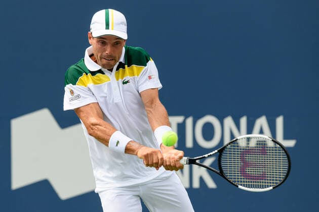 TORONTO, ON - AUGUST 12: Roberto Bautista Agut (ESP) returns the ball during his National Bank Open tennis tournament third round game on August 12, 2021, at Aviva Centre in Toronto, ON, Canada. (Photo by Julian Avram Icon Sportswire) TENNIS: AUG 12 National Bank Open Icon2108120758