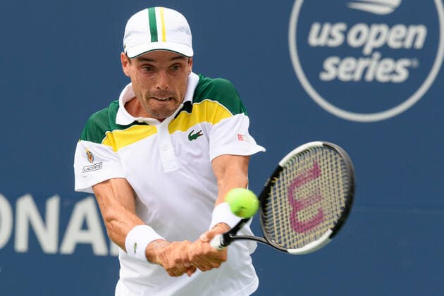TORONTO, ON - AUGUST 12: Roberto Bautista Agut (ESP) returns the ball during his National Bank Open tennis tournament third round game on August 12, 2021, at Aviva Centre in Toronto, ON, Canada. (Photo by Julian Avram Icon Sportswire) TENNIS: AUG 12 National Bank Open Icon2108120760