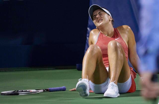 August 12, 2021, Montreal, PQ, Canada: Canada s Bianca Andreescu sits on the court after falling during her match against Ons Jabeur, of Tunisia, during round of sixteen play at the National Bank Open tennis tournament Thursday August 12, 2021 in Montreal. Bianca Andreescu  - ZUMAc35_ 20210812_zaf_c35_206 Copyright: xPaulxChiassonx