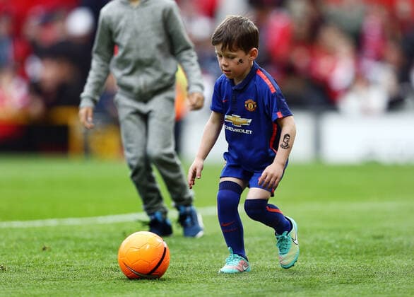 Mandatory Credit: Photo by Matt West BPI Shutterstock (4775543at) Kai Rooney sports a tattoo of Ronaldo on his arm (probably not real) Barclays Premier League 2014 15 Manchester United, ManU v Arsenal Old Trafford, Sir Matt Busby Way, Manchester, United Kingdom - 17 May 2015 EDITORIAL USE ONLY No use with unauthorised audio, video, data, fixture lists (outside the EU), club league logos or live services. Online in-match use limited to 45 images (+15 in extra time). No use to emulate moving images. No use in betting, games or single club league player publications services. Barclays Premier League 2014 15 Manchester United v Arsenal Old Trafford, Sir Matt Busby Way, Manchester, United Kingdom - 17 May 2015 EDITORIAL USE ONLY No use with unauthorised audio, video, data, fixture lists (outside the EU), club league logos or live services. Online in-match use limited to 45 images (+15 in extra time). No use to emulate moving images. No use in betting, games or Copyright: xMattxWest BPI Shutterstockx 4775543at