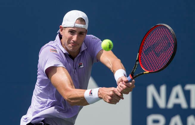 (210813) -- TORONTO, Aug. 13, 2021 -- John Isner of the United States returns the ball against Andrey Rublev of Russia during the third round of men s singles match at the 2021 National Bank Open in Toronto, Canada, on Aug. 12, 2021. (Photo by Xinhua) (SP)CANADA-TORONTO-TENNIS-NATIONAL BANK OPEN-MEN S SINGLE ZouxZheng 