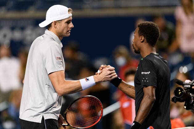 TORONTO, ON - AUGUST 13: John Isner (USA) shakes hands with Gael Monfils (FRA) after winning his National Bank Open tennis tournament quarterfinals match on August 13, 2021, at Aviva Centre in Toronto, ON, Canada. (Photo by Julian Avram Icon Sportswire) TENNIS: AUG 13 National Bank Open Icon2108130831