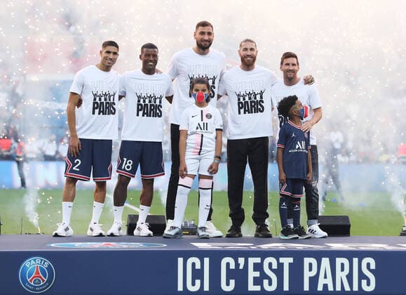 (210815) -- PARIS, Aug. 15, 2021 -- Moroccan defender Achraf Hakimi, Dutch midfielder Georginio Wijnaldum, Italian goalkeeper Gianluigi Donnarumma, Spanish defender Sergio Ramos and Argentinian forward Lionel Messi (from L to R) pose during the new recruits presentation ceremony prior to the French Ligue 1 football match between Paris Saint-Germain and Racing Club Strasbourg at the Parc des Princes stadium in Paris, France, Aug. 14, 2021. ) (SP)FRANCE-PARIS-FOOTBALL-PARIS SAINT-GERMAIN-NEW RECRUITS GaoxJing 