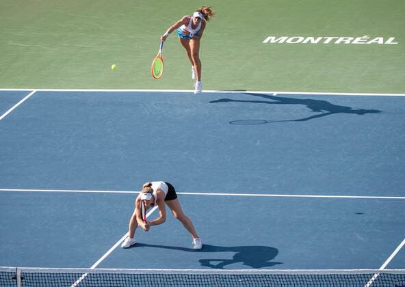 August 15, 2021, Montreal, PQ, Canada: Gabriela Dabrowski, bottom, of Canada, ducks as partner Luisa Stefani, of Brazil, serves to Darija Jurak, of Croatia, and Andreja Klepac, of Slovenia, during the doubles final of the National Bank Open womenöÄÃ s tennis tournament in Montreal, Saturday, Aug. 14, 2021. Gabriela Dabrowski, Luisa Stefani, Darija Jurak, Andreja Klepac - ZUMAc35_ 20210815_zaf_c35_153 Copyright: xGrahamxHughesx