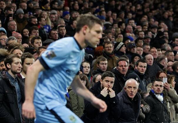 Mandatory Credit: Photo by Michael Zemanek BPI Shutterstock (4397341dp) James Milner of Manchester City takes a corner kick under pressure from Chelsea fans Barclays Premier League 2014 15 Chelsea v Manchester City Stamford Bridge, Fulham Rd, London, United Kingdom - 31 Jan 2015 EDITORIAL USE ONLY No use with unauthorised audio, video, data, fixture lists (outside the EU), club league logos or live services. Online in-match use limited to 45 images (+15 in extra time). No use to emulate moving images. No use in betting, games or single club league player publications services. Barclays Premier League 2014 15 Chelsea v Manchester City Stamford Bridge, Fulham Rd, London, United Kingdom - 31 Jan 2015 EDITORIAL USE ONLY No use with unauthorised audio, video, data, fixture lists (outside the EU), club league logos or live services. Online in-match use limited to 45 images (+15 in extra time). No use to emulate moving images. No use in betting, games or Copyright: xMichaelxZemanek BPI Shutterstockx 4397341dp