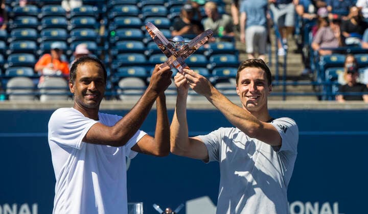 (210816) -- TORONTO, Aug. 16, 2021 -- Rajeev Ram of the United States and Joe Salisbury (R) of Britain pose for photos during the awarding ceremony after the men s doubles final against Mate Pavic and Nikola Mektic of Croatia at the 2021 National Bank Open in Toronto, Canada, on Aug. 15, 2021. (Photo by Xinhua) (SP)CANADA-TORONTO-TENNIS-NATIONAL BANK OPEN-MEN S DOUBLES-FINAL ZouxZheng 