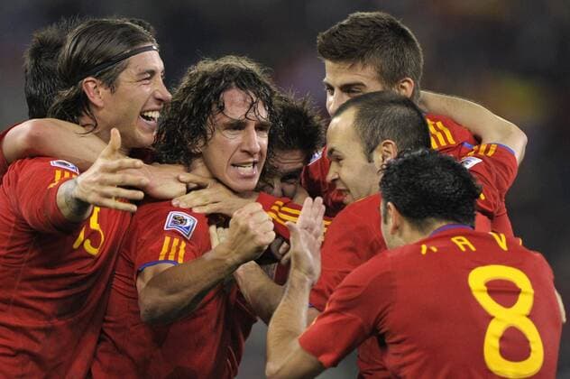 Mandatory Credit: Photo by Back Page Images Shutterstock (1204566h) Carles Puyol of Spain is surrounded by team-mates after scoring the winning goal Germany v Spain, 2010 FIFA World Cup, WM, Weltmeisterschaft, Fussball semi-final football match, Moses Mabhida Stadium, Durban, South Africa - 07 Jul 2010 Spain beat Germany 1-0 EDITORIAL USE ONLY Germany v Spain, 2010 FIFA World Cup semi-final football match, Moses Mabhida Stadium, Durban, South Africa - 07 Jul 2010 EDITORIAL USE ONLY  Copyright: xBackxPagexImages Shutterstockx 1204566h