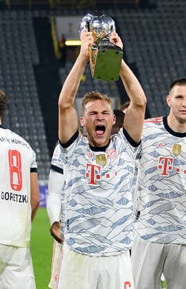 (210818) -- DORTMUND, Aug. 18, 2021 -- Joshua Kimmich of Bayern Munich celebrates with the trophy after the German Supercup football match against Borussia Dortmund in Dortmund, Germany, Aug. 17, 2021. (Photo by Xinhua) (SP)GERMANY-DORTMUND-FOOTBALL-GERMAN SUPERCUP-DORTMUND VS MUNICH UlrichxHufnagel 