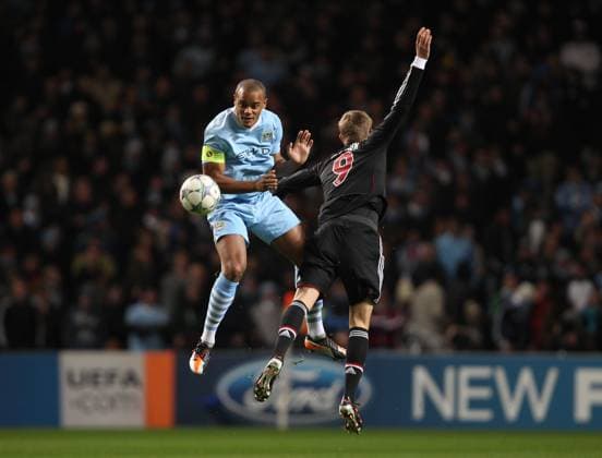 Mandatory Credit: Photo by Back Page Images Shutterstock (1517347b) Vincent Kompany of Manchester City in action with Nils Petersen of Bayern Munich Manchester City Vs. Bayern Munich, UEFA Champions League Football, City of Manchester Stadium, Manchester, Britain - 07 Dec 2011 EDITORIAL USE ONLY Manchester City Vs. Bayern Munich, UEFA Champions League Football, City of Manchester Stadium, Manchester, Britain - 07 Dec 2011 EDITORIAL USE ONLY  Copyright: xBackxPagexImages Shutterstockx 1517347b