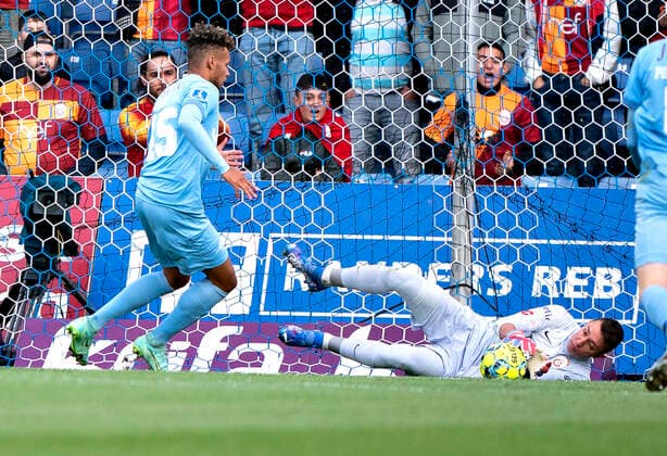 Galatasarays goalkeeper Fernandon Muslera C saves against Randers FCs Marvin Egho in the Europa League qualifier between Randers FC and Galatasaray at Cepheus Park in Randers, Thursday 19 August 2021, Randers Jylland Denmark  Copyright: HenningxBagger HenningxBaggerx COP101 spdk20210819-195615-L