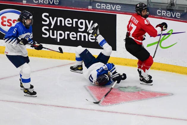 August 20, 2021, Calgary, AB, Canada: Finland s ELISA HOLOPAINEN (centre) takes a fall after being checked by Canada s JAMIE RATTRAY (right) during the Finland vs Canada preliminary round game at the 2021 IIHF Women s World Championship, WM, Weltmeisterschaft in Calgary, AB, Canada on Aug 20, 2021. Canada defeated Finland 5-3. The 12-day tournament returns after more than two year due to the COVID-19 pandemic. Calgary Canada - ZUMAj113 20210820_zip_j113_084 Copyright: xGavinxJohnx