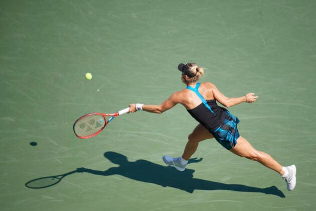 CINCINNATI, OH - AUGUST 21: Angelique Kerber of Germany stretches to hit a hits a forehand shot during the semifinal match on day 7 of the Western & Southern Open at the Lindner Family Tennis Center in Mason, Ohio on August 21, 2021. (Photo by Shelley Lipton Icon Sportswire) TENNIS: AUG 21 Western & Southern Open Icon21082121