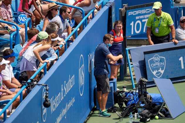CINCINNATI, OH - AUGUST 21: A camera operator gathers broken gear after being crashed by Daniil Medvedev of Russia during the semifinal match on day 7 of the Western & Southern Open at the Lindner Family Tennis Center in Mason, Ohio on August 21, 2021. (Photo by Shelley Lipton Icon Sportswire) TENNIS: AUG 21 Western & Southern Open Icon210821419