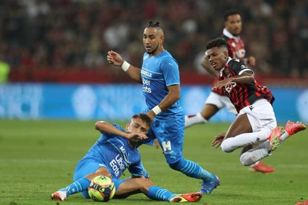 Nice, France, 22nd August 2021. Dimitri Payet of Olympique De Marseille looks on as Hicham Boudaoui of OGC Nice clashes with Cenzig Under of Olympique De Marseille during the Lique 1 match at Allianz Riviera Stadium, Nice. Picture credit should read: Jonathan Moscrop Sportimage EDITORIAL USE ONLY. No use with unauthorised audio, video, data, fixture lists, club league logos or live services. Online in-match use limited to 120 images, no video emulation. No use in betting, games or single club league player publications. SPI-1148-0008