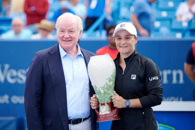 CINCINNATI, OH - AUGUST 22: Ashleigh Barty of Australia holds the Rookwood Cup with Chairman, President, and CEO John Barrett of Western & Southern Finacial Group after winning the womenÕs championship match of the Western & Southern Open at the Lindner Family Tennis Center in Mason, Ohio on August 22, 2021. Barty defeated Jil Teichmann of Switzerland 6-1, 6-1. (Photo by Shelley Lipton Icon Sportswire) TENNIS: AUG 22 Western & Southern Open Icon210822502