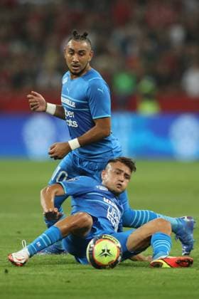 Nice, France, 22nd August 2021. Dimitri Payet of Olympique De Marseille looks on as team mate Cenzig Under slides in to challenge for the ball during the Lique 1 match at Allianz Riviera Stadium, Nice. Picture credit should read: Jonathan Moscrop Sportimage EDITORIAL USE ONLY. No use with unauthorised audio, video, data, fixture lists, club league logos or live services. Online in-match use limited to 120 images, no video emulation. No use in betting, games or single club league player publications. SPI-1148-0071
