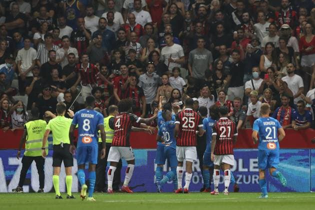 Nice, France, 22nd August 2021. Dimitri Payet of Olympique De Marseille throws a bottle of water back into the crowd after if appeared to be thrown in his direction during the Lique 1 match at Allianz Riviera Stadium, Nice. Picture credit should read: Jonathan Moscrop Sportimage EDITORIAL USE ONLY. No use with unauthorised audio, video, data, fixture lists, club league logos or live services. Online in-match use limited to 120 images, no video emulation. No use in betting, games or single club league player publications. SPI-1148-0086