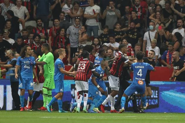Nice, France, 22nd August 2021. Jean-Clair Todibo of OGC Nice and Boubacar Kamara of Olympique De Marseille push an OGC Nice fan back towards the crowd as he kicks out at Gerson Santos Da Silva of Olympique De Marseille during the Lique 1 match at Allianz Riviera Stadium, Nice. Picture credit should read: Jonathan Moscrop Sportimage EDITORIAL USE ONLY. No use with unauthorised audio, video, data, fixture lists, club league logos or live services. Online in-match use limited to 120 images, no video emulation. No use in betting, games or single club league player publications. SPI-1148-0088